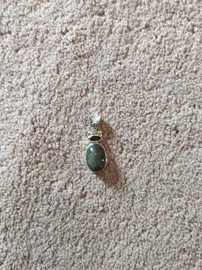 Elegant Silver Pendant with Dark Stone Not Sure What Kind.Add To Favorite Chain